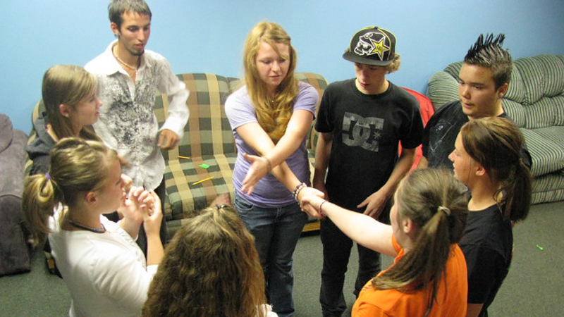 Indoor photo of group talking